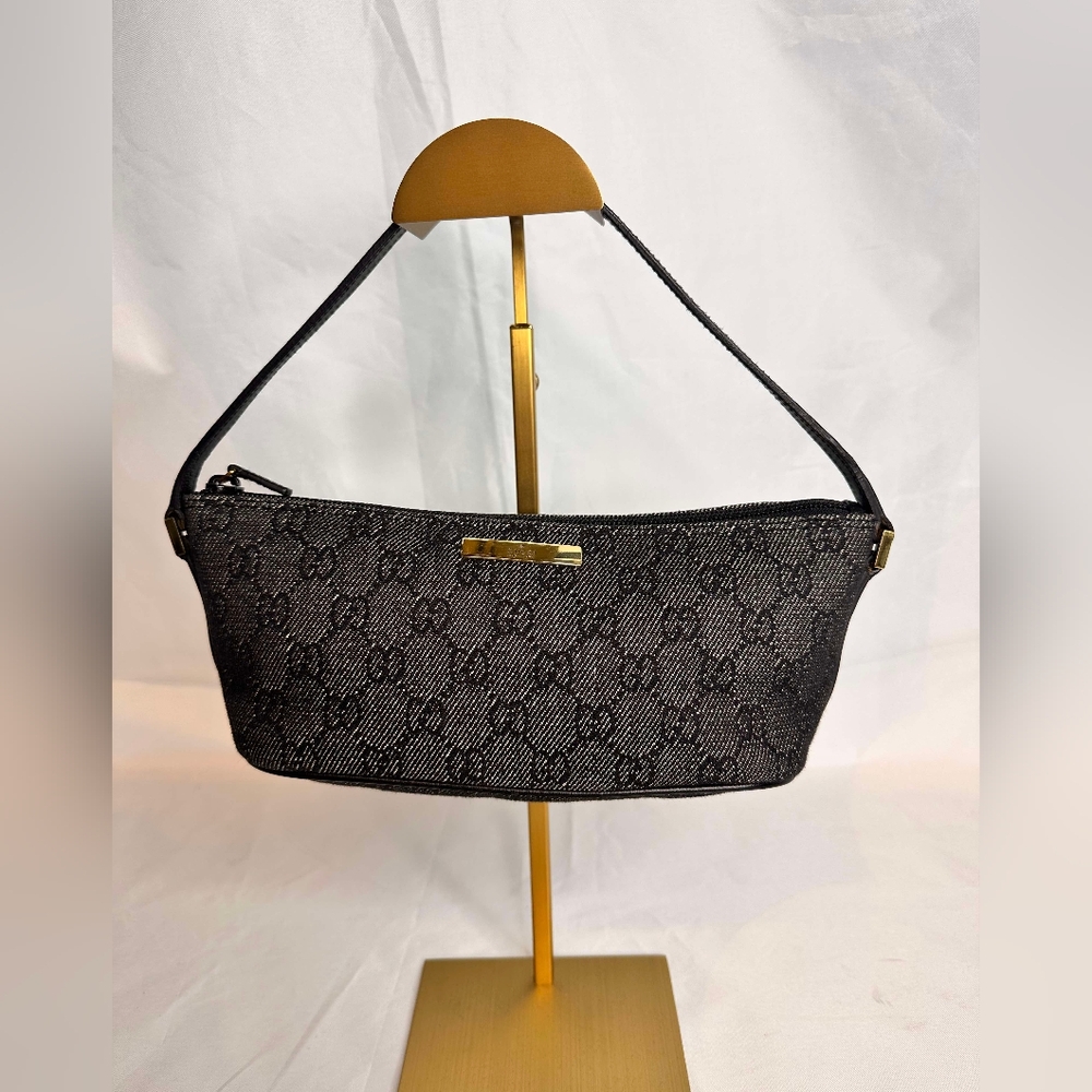 GUCCI 
Monogram Boat Pochette Brown